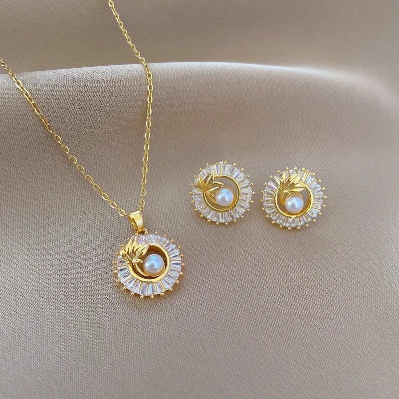 Personalized jewelry set with necklace, earrings, and ring featuring diamond-accented leaves design