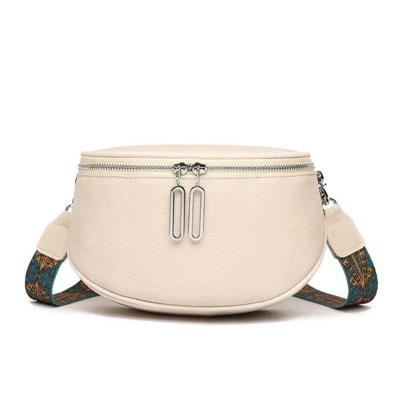 Women's soft PU leather messenger bag in saddle shape with a cross-body strap.