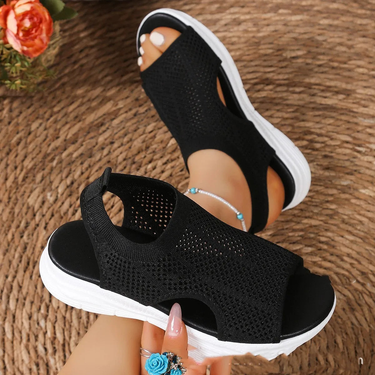 Women's black platform sports sandals with a flat toe and rubber sole on a light background