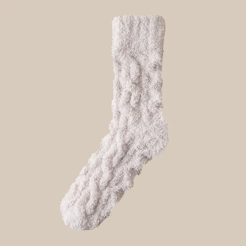 Plush coral fleece socks in various colors, designed for cozy and comfortable home wear