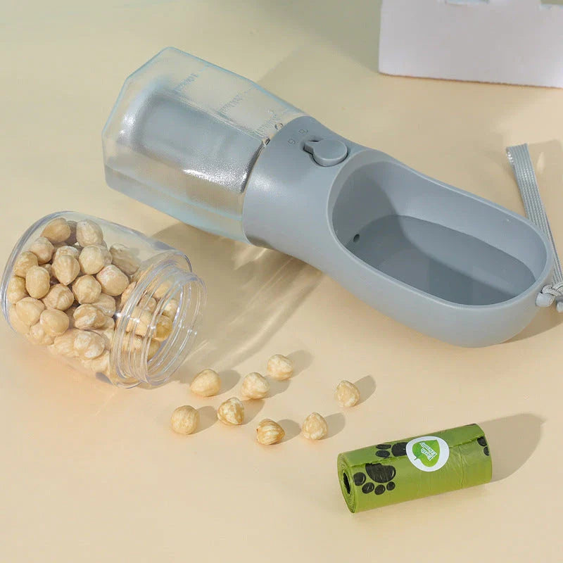 Portable 3-in-1 pet water bottle with built-in filtration system, food container, and waste bag storage compartment