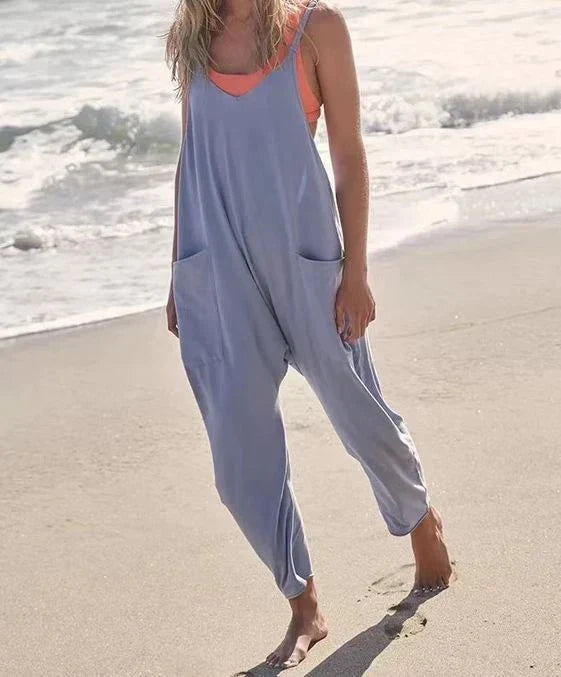 A stylish sleeveless jumpsuit with pockets and zipper closure, available in a variety of colors