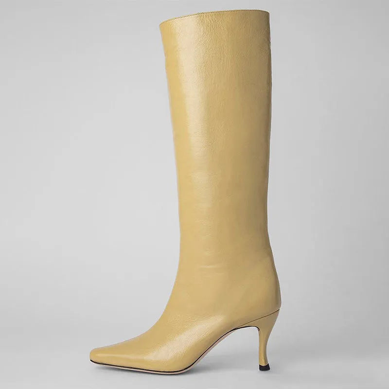 A pair of women's black square-toe cowboy boots made from microfiber leather.