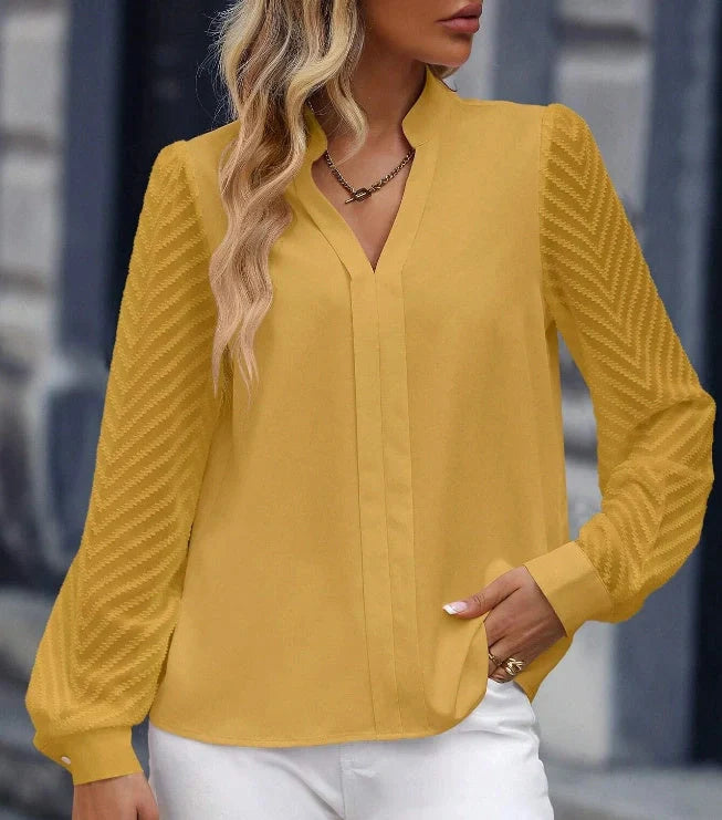Elegant V-neck chiffon blouse with lace trim, available in a range of contemporary colours for the modern woman's wardrobe.