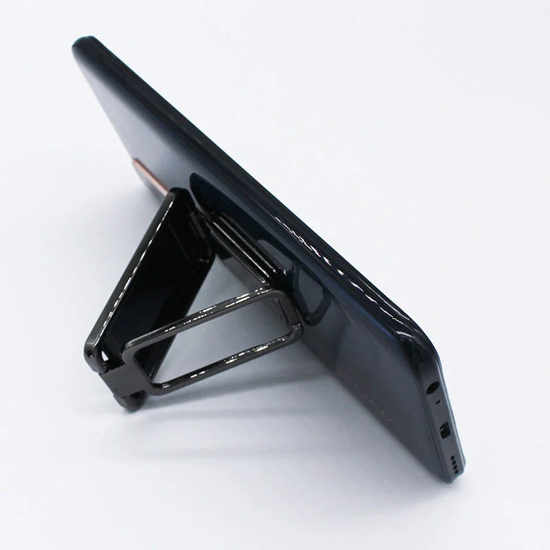 Adjustable magnetic phone stand for desk and car use, compatible with all smartphones and tablets