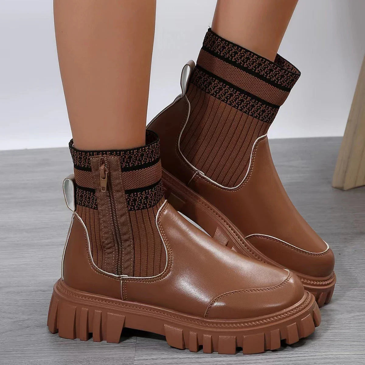 Stylish mid-calf boots with zipper closure, non-slip rubber sole, and knitted patchwork upper in beige, black, and brown colors.