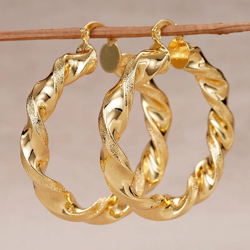Geometric ring design ear clips for women with drop-shaped copper construction and electroplated finish