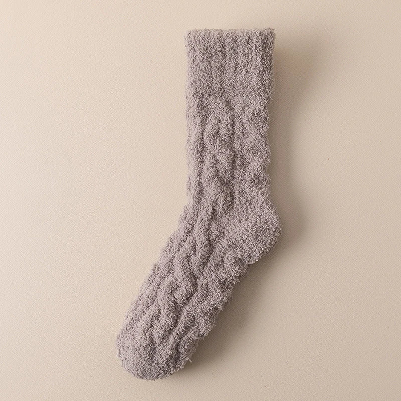 Plush coral fleece socks in various colors, designed for cozy and comfortable home wear