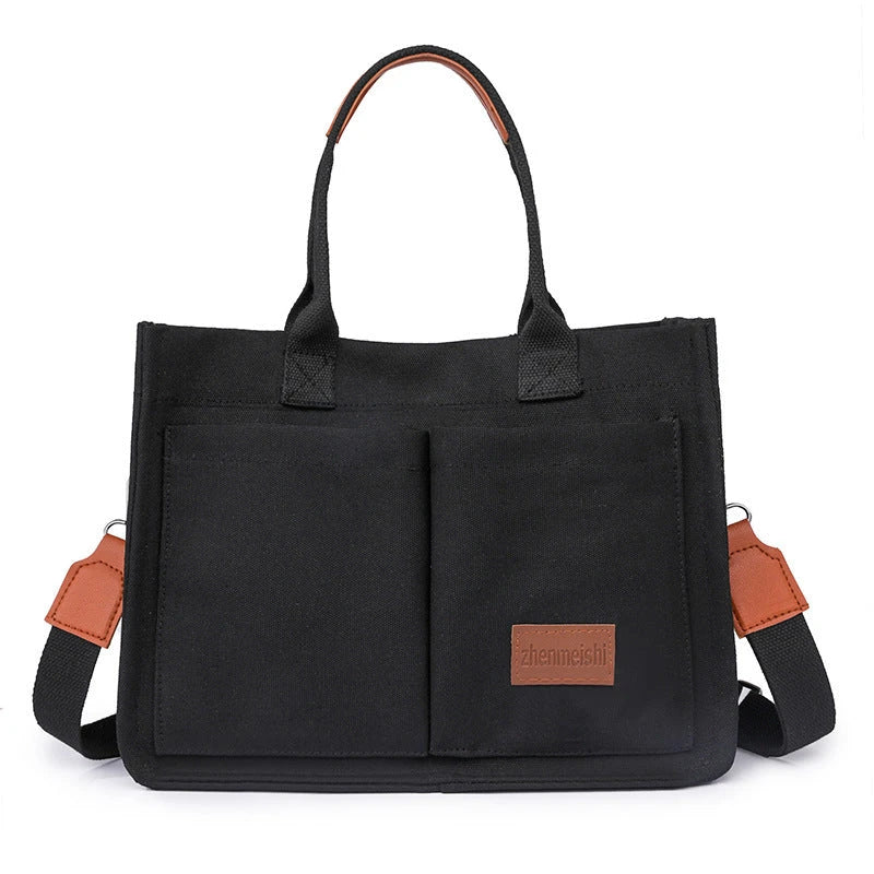 Premium canvas tote bag with multiple pockets, adjustable shoulder strap, and stylish design for everyday use