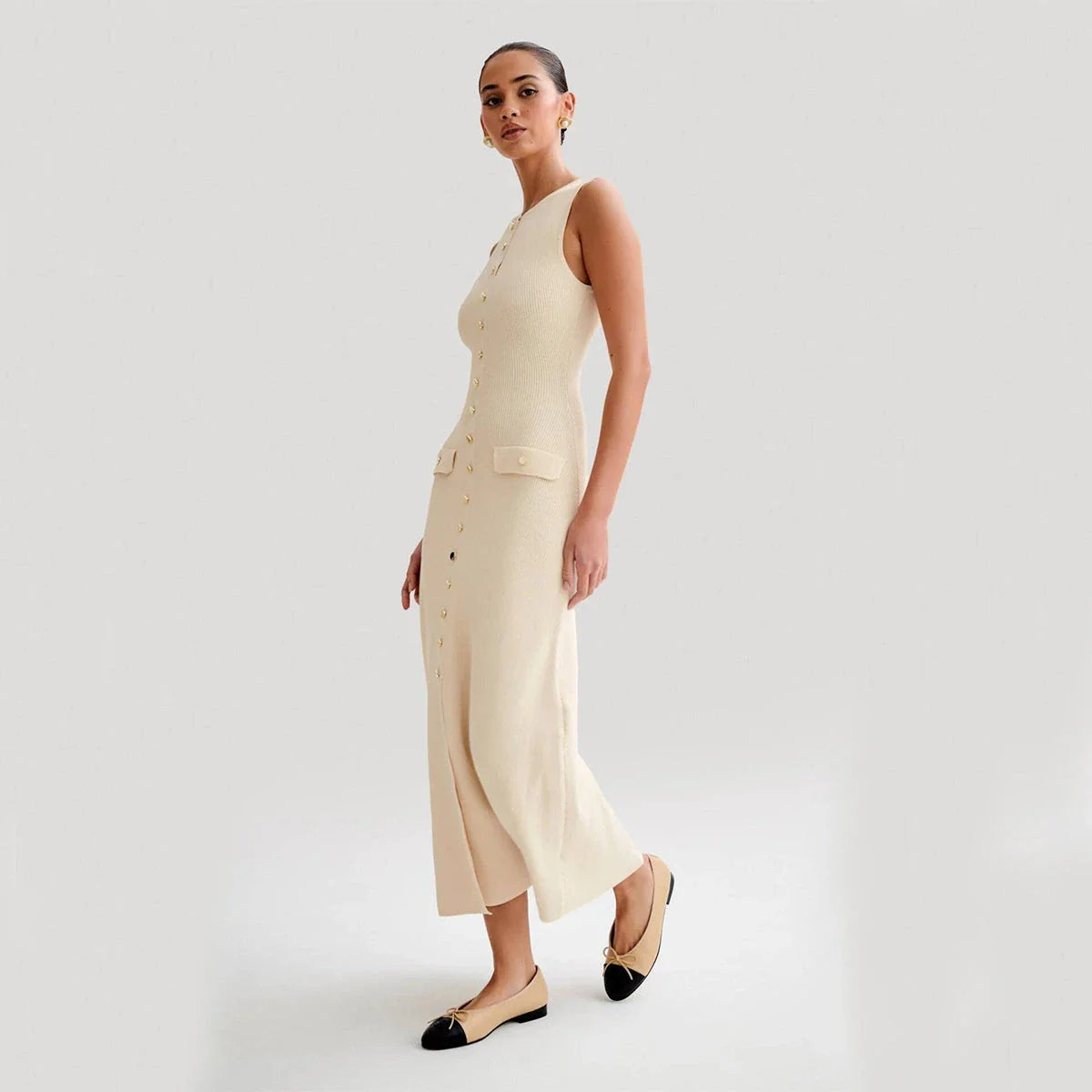 Sleeveless knit dress in apricot and blue colors, showcasing a slim, flattering silhouette and premium polyester construction