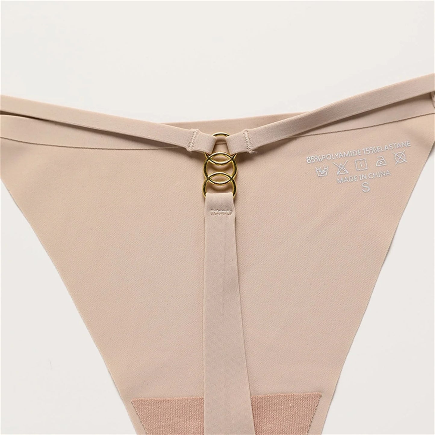 A set of seamless stretch hipster briefs in assorted neutral tones, featuring a low-rise waistline and t-back design for a smooth, flattering look.