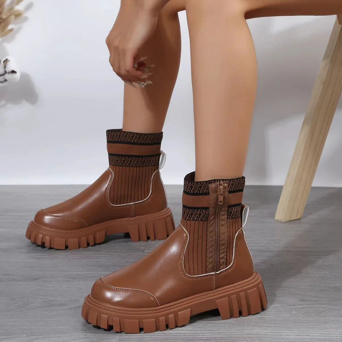 Stylish mid-calf boots with zipper closure, non-slip rubber sole, and knitted patchwork upper in beige, black, and brown colors.