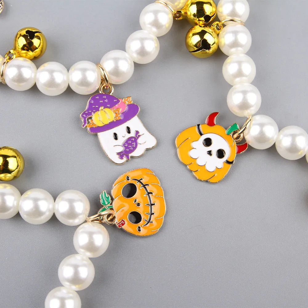 Three pearl necklaces with bells for pet Halloween costumes and decoration
