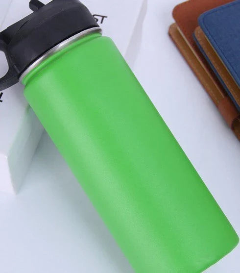 Stainless steel insulated water bottle with wide mouth and push-button lid for hot and cold beverages