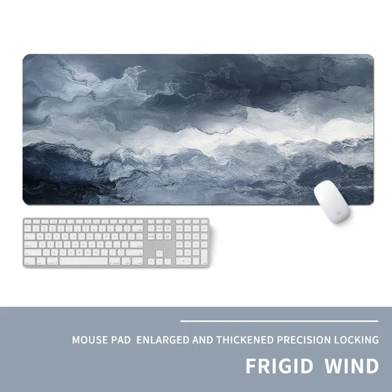 Oversized rectangular mouse pad with a printed design on a desk, next to a keyboard and mouse.