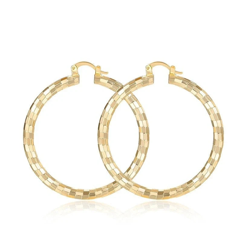 Elegant geometric copper earrings with 18-carat gold plating, featuring a minimalist elliptical design