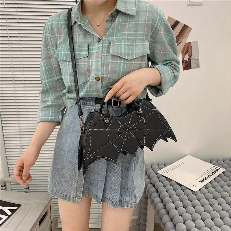 A stylish Halloween shoulder bag with a captivating spider web design, made of durable PU leather and offering ample storage space.