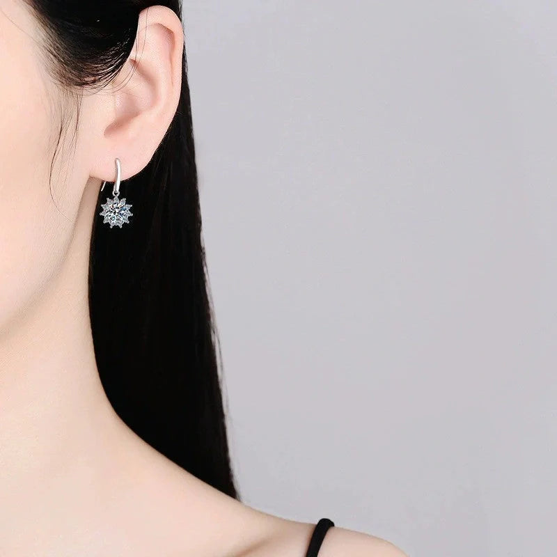 Elegant white gold sunflower stud earrings with a lustrous finish, a versatile accessory for the modern British woman