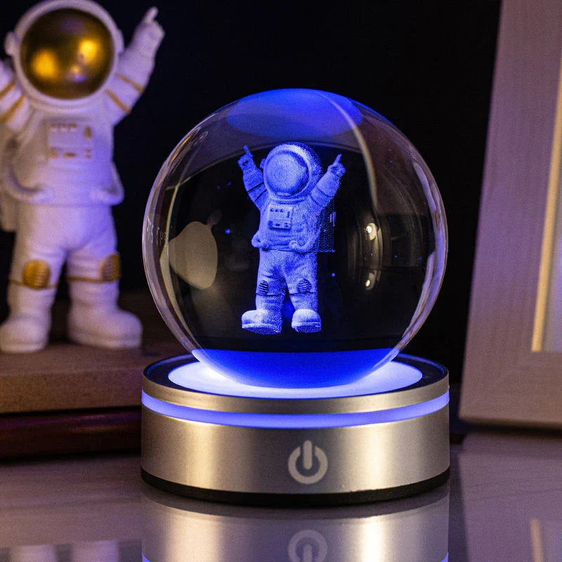 Luminous crystal ball with various celestial-inspired designs, including the Milky Way, Solar System, and Constellation.