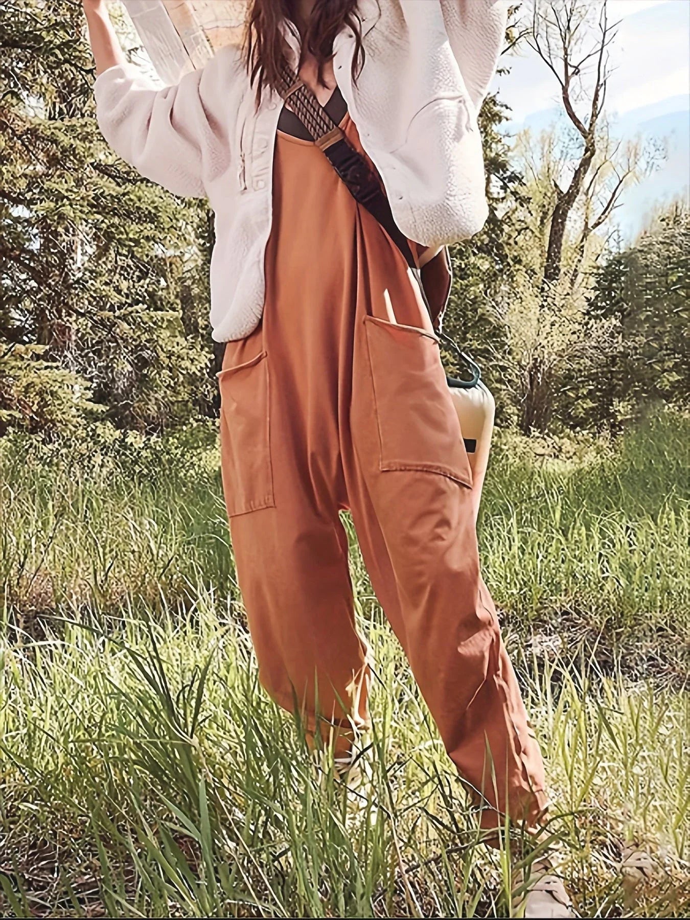 A stylish sleeveless jumpsuit with pockets and zipper closure, available in a variety of colors
