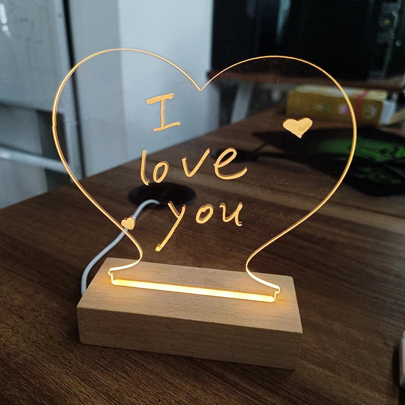 Customizable LED message board with warm lighting, acrylic design, and included erasable pen for personalized notes and artwork