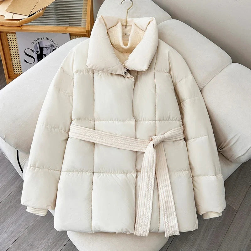 Stylish plaid belted winter coat for women in black, white, and brown