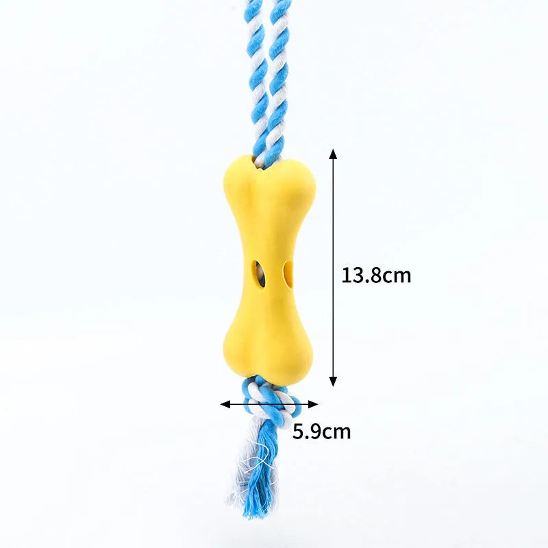 Green porous bone dog toy with knotted rope, hollow for treats, measuring 138mm