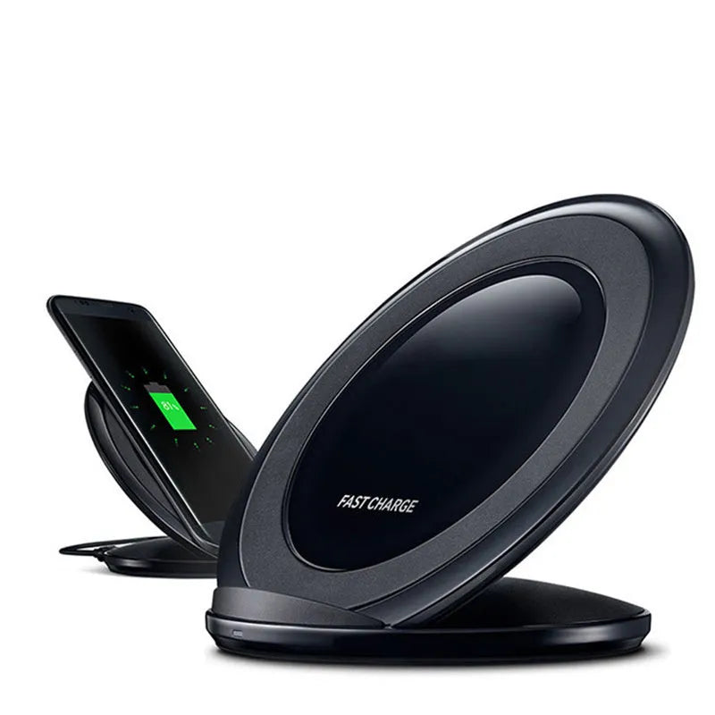 Black Qi wireless charging pad for Samsung Galaxy Note Edge on a desk.