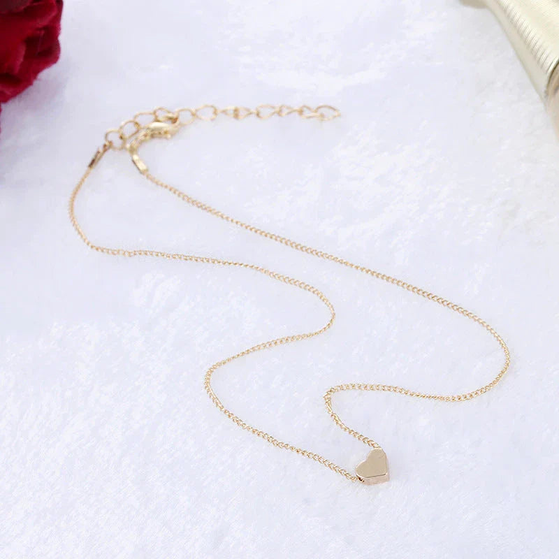 A stylish double-sided love pendant necklace made of premium alloy and featuring a chic geometric design, perfect for elevating any outfit.