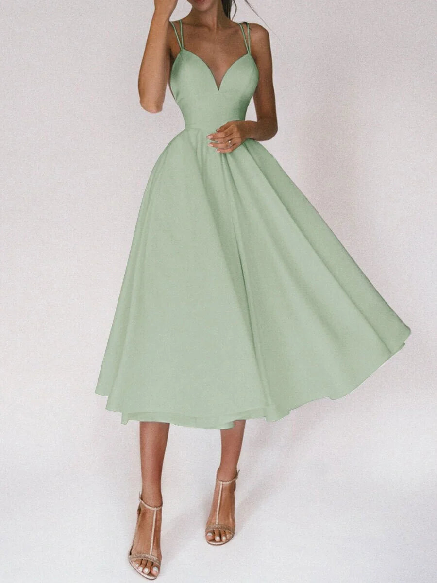 Elegant V-neck dress with adjustable straps, available in a range of vibrant colours for stylish summer wear