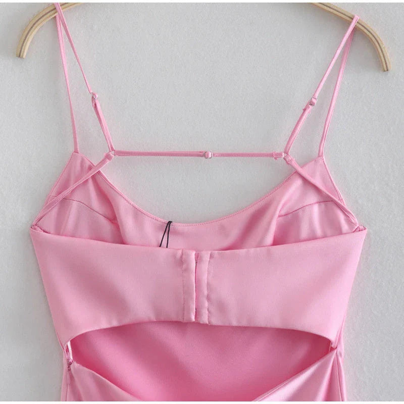 Elegant satin slip dress in pink with a square neckline, sleeveless design, and backless detail