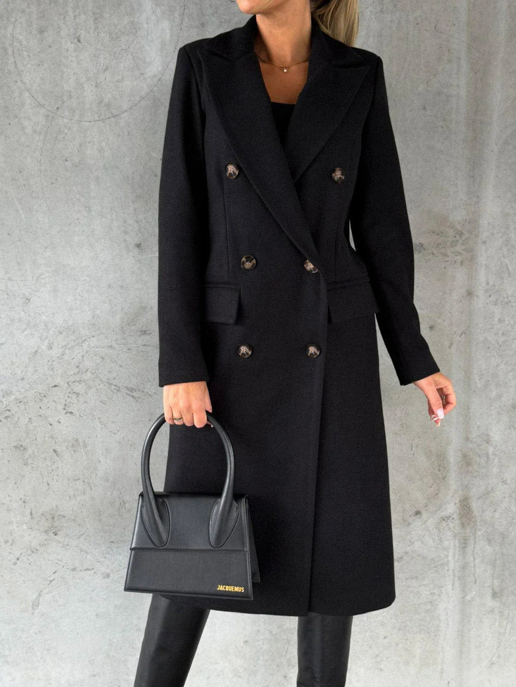 A stylish double-breasted winter coat made of premium polyester with a sleek lapel design and slim silhouette.