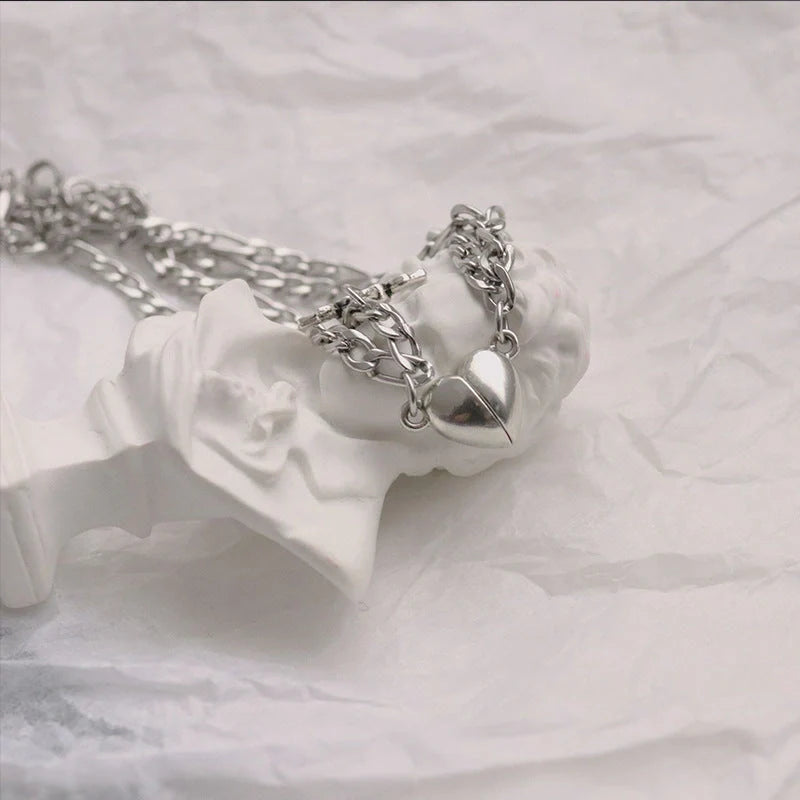 Heart-shaped couple bracelets with adjustable chain, perfect for romantic gifts.