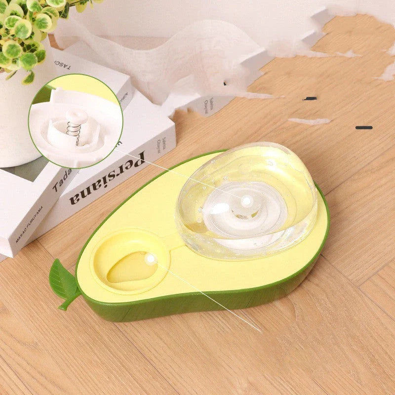 Avocado-shaped automatic pet food and water dispenser for dogs and cats, featuring a raised feeder, slow-feed bowl, and adjustable water flow