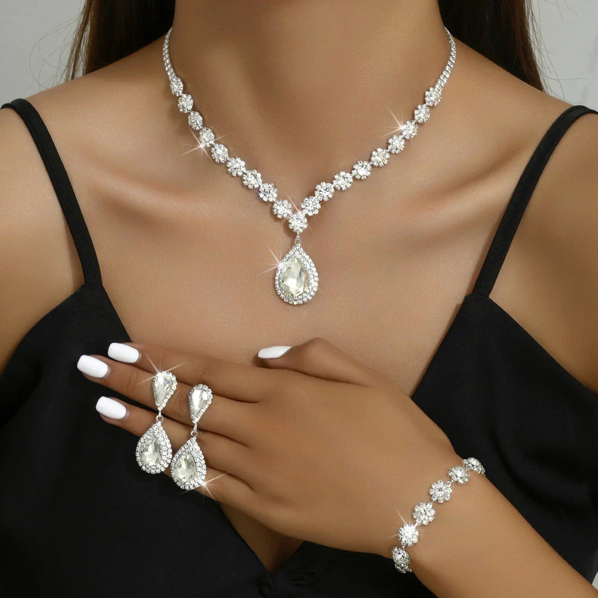 Bridal jewelry set with necklace, earrings, and bracelet featuring a sun and moon design with rhinestones