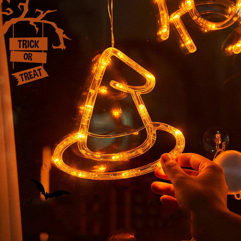 Spooky Halloween window lights featuring ghostly silhouettes, carved pumpkins, and creepy spiders for festive seasonal decor