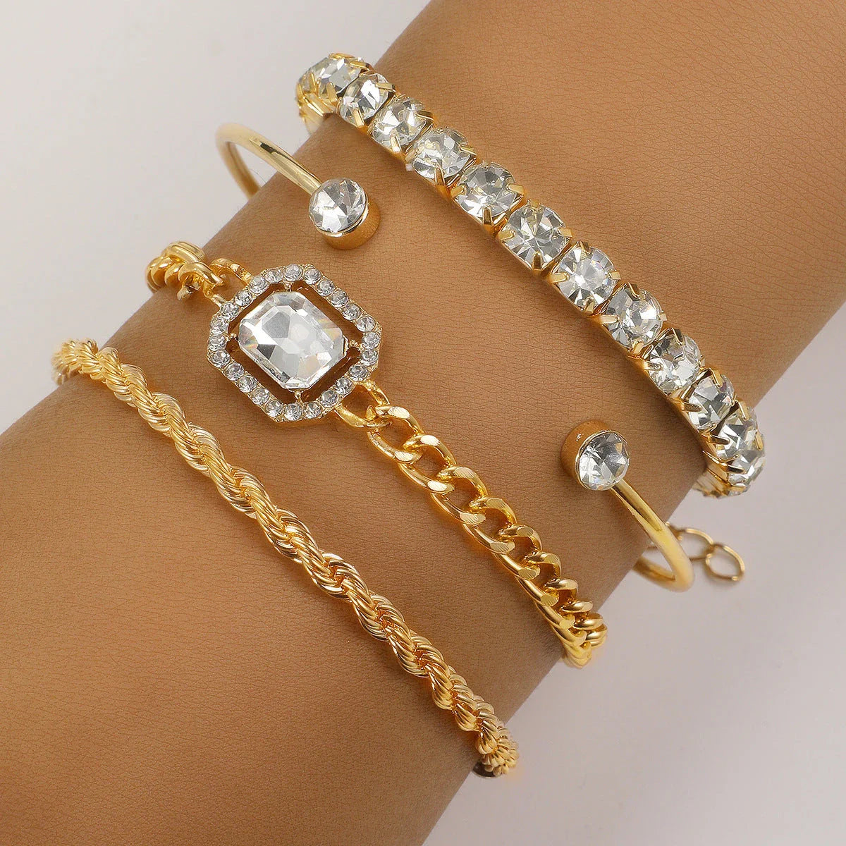 4-piece crystal bracelet set with boho-chic design, featuring sparkling rhinestones and adjustable alloy construction