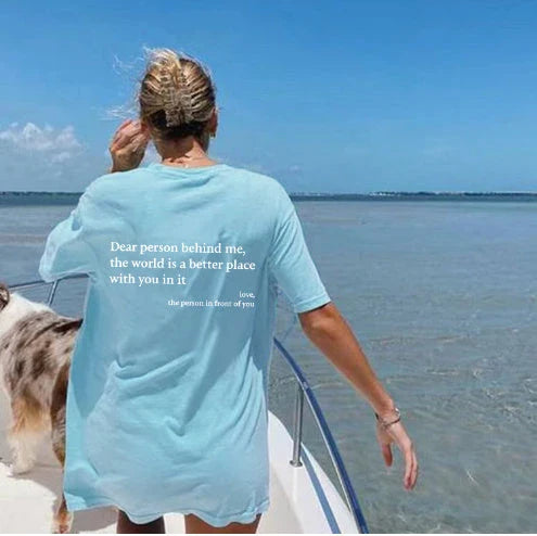 Stylish women's graphic t-shirt with trendy slogan, featuring a vibrant print design and comfortable short sleeve silhouette.