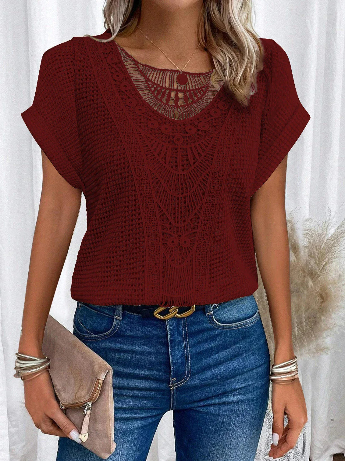 A stylish and comfortable short-sleeve t-shirt for women, featuring a unique hollowed-out design and breathable polyester fabric.