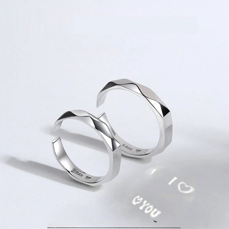 Elegant S925 sterling silver rings with a hidden love pattern design, adjustable sizing for a personalized fit.
