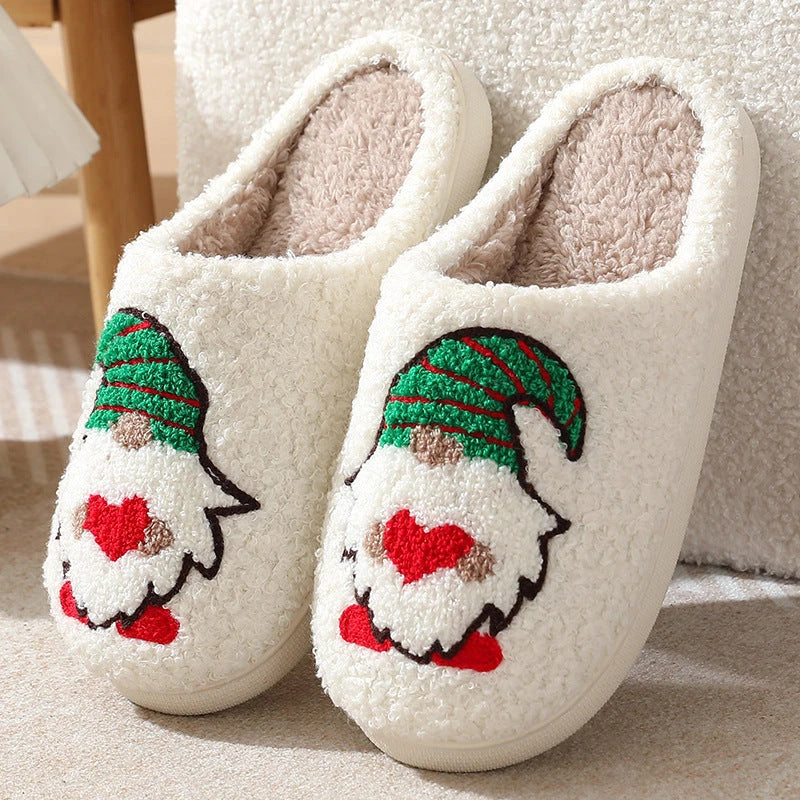 Cozy Santa Claus-themed slippers with plush upper and anti-slip soles for comfortable indoor wear during the holidays