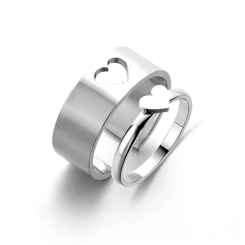 Elegant titanium steel rings in various designs including hearts, butterflies, and crosses, for a timeless and versatile accessory