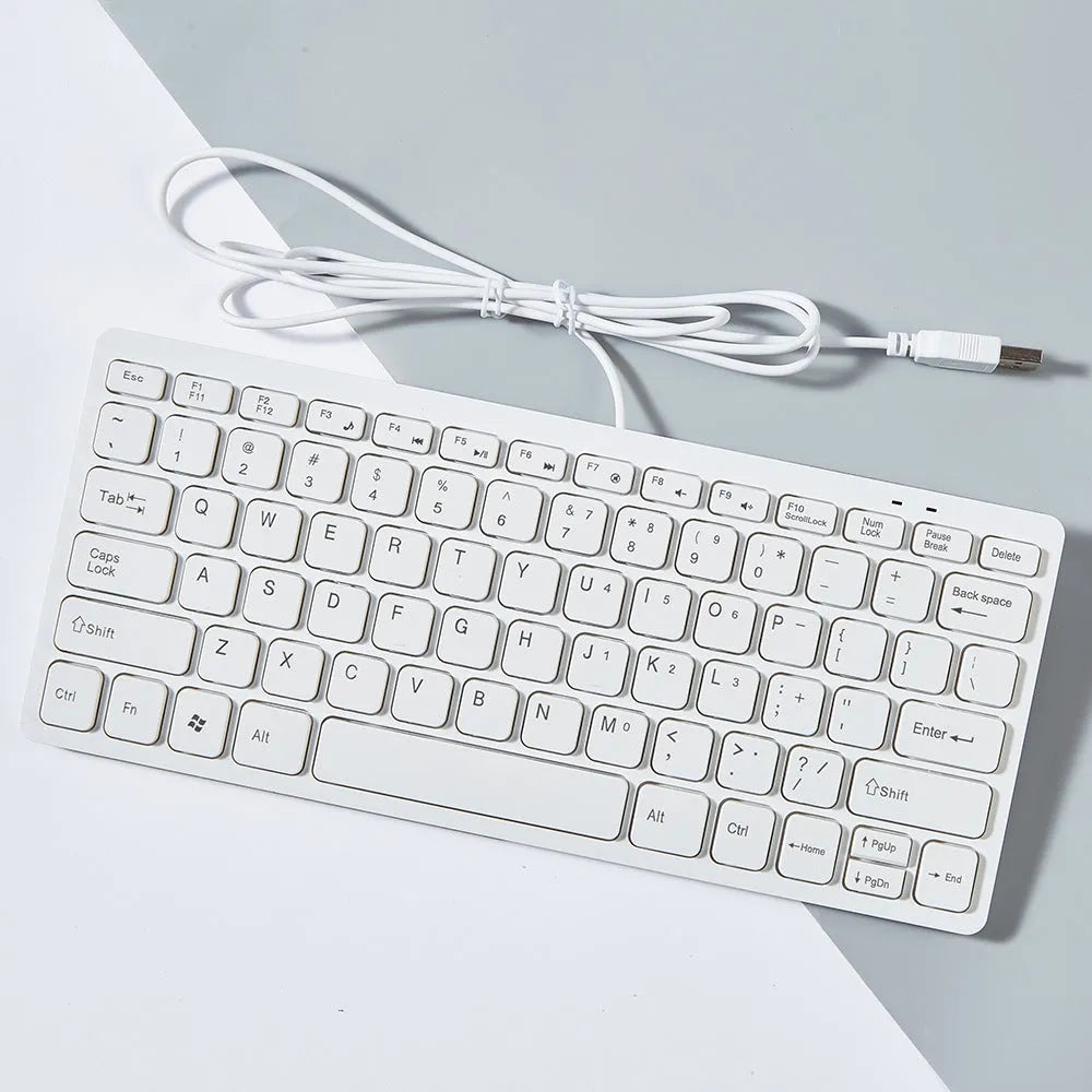 USB wired mini keyboard in four colour options showing compact 280mm design