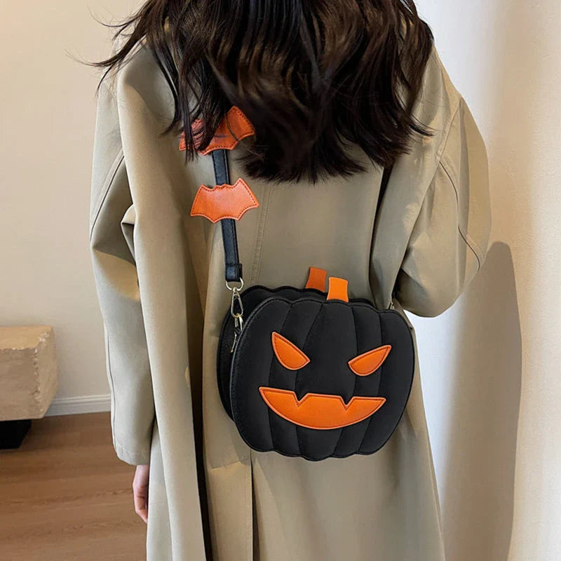 Pumpkin cartoon shoulder bag with adjustable strap and roomy interior, available in various Halloween-inspired colors