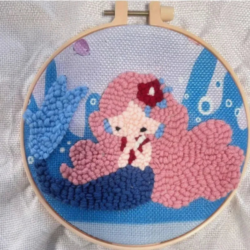 Beginner embroidery craft suit showing six cartoon designs including turtle, sheep, horse, fox, butterfly, and mermaid patterns