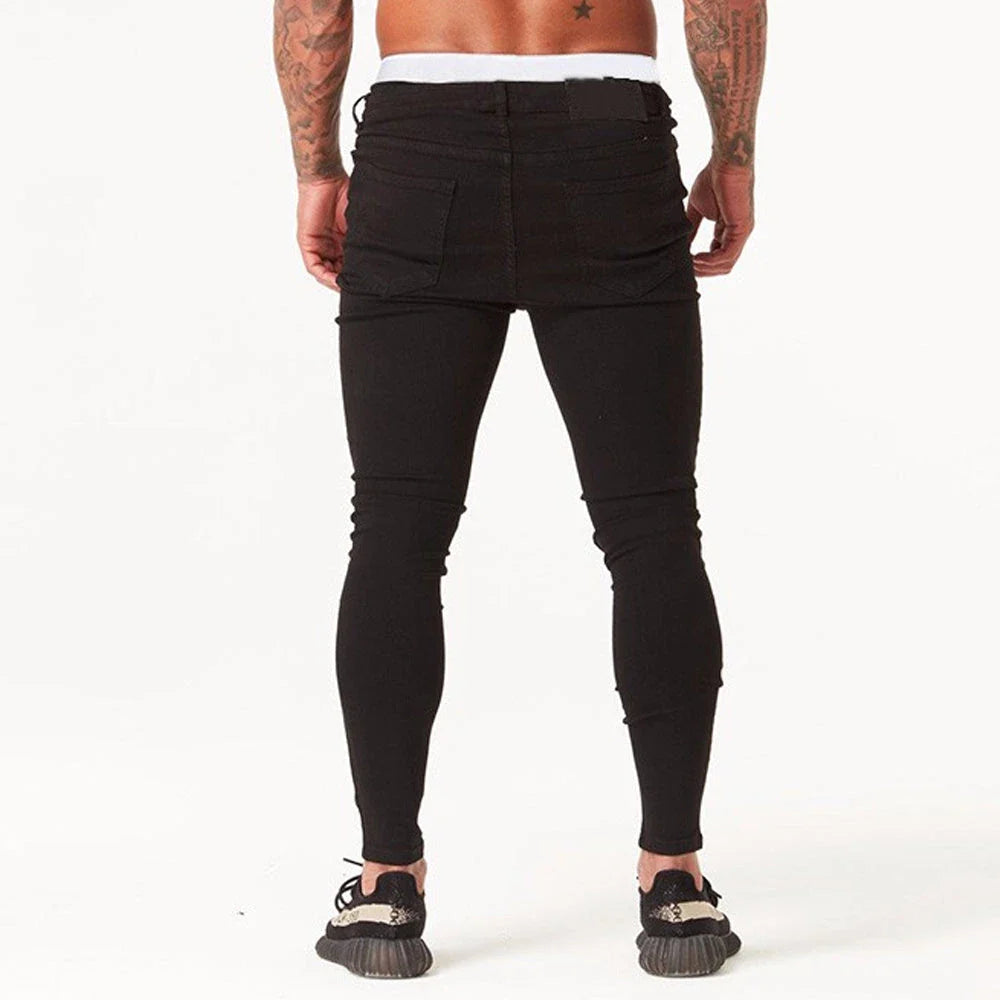 Trendy distressed black skinny jeans for men, featuring a super-elastic cotton construction and edgy, lived-in look