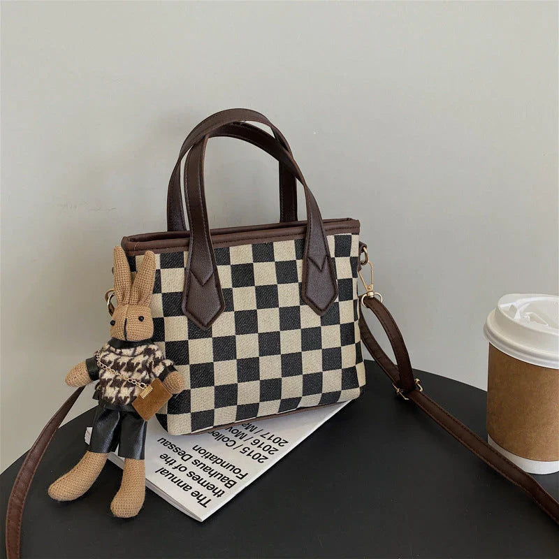 Premium houndstooth and plaid crossbody bags with stylish patterns, comfortable wool material, and versatile design