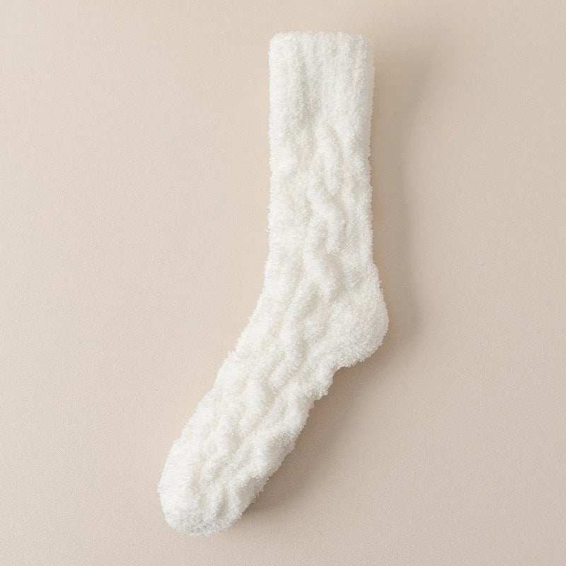 Plush coral fleece socks in various colors, designed for cozy and comfortable home wear