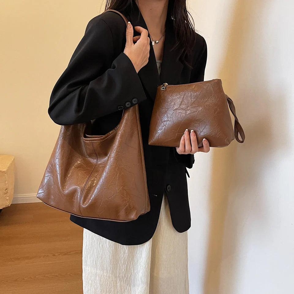 Classic vintage-inspired women's shoulder bag in a range of sophisticated colours, featuring a roomy interior, adjustable strap, and premium materials for timeless British style.