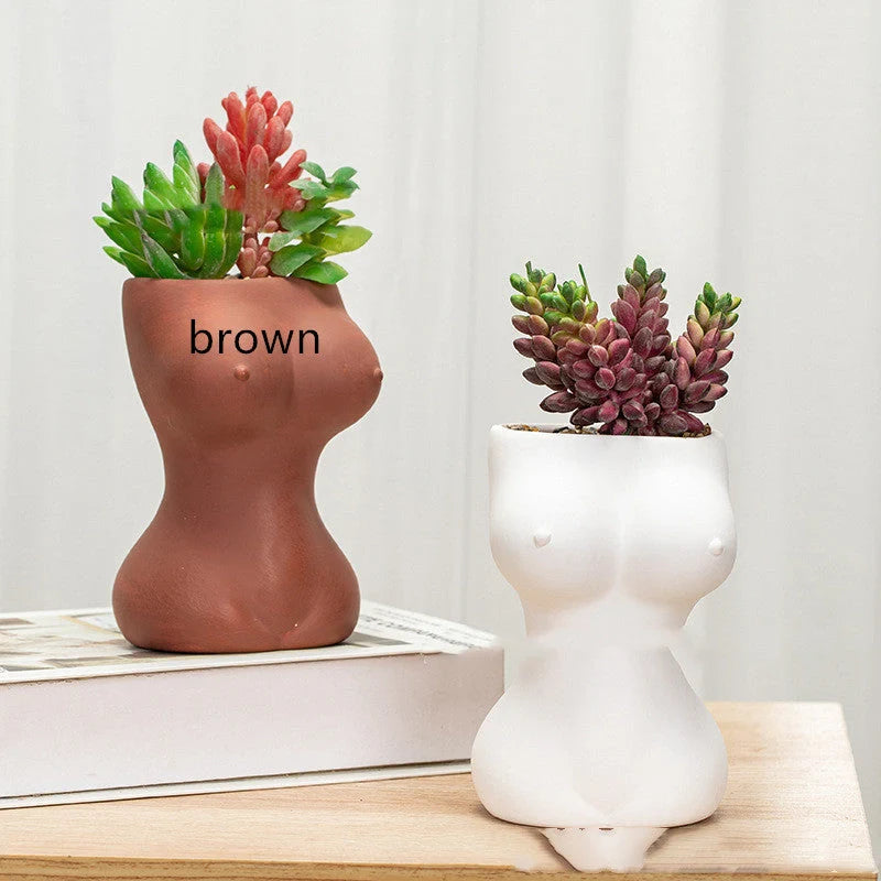 Elegant ceramic flower pots in various colours, featuring intricate designs inspired by classic European styles